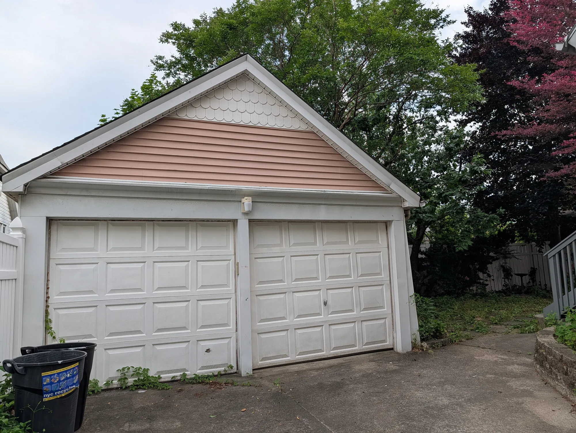 The two-car detached garage with scalloped gable