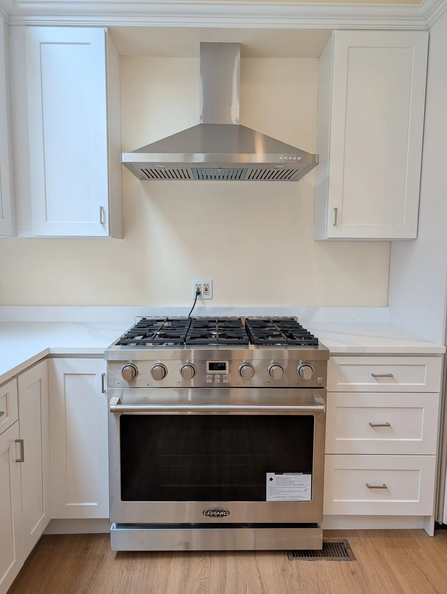 The stainless gas range with vented hood