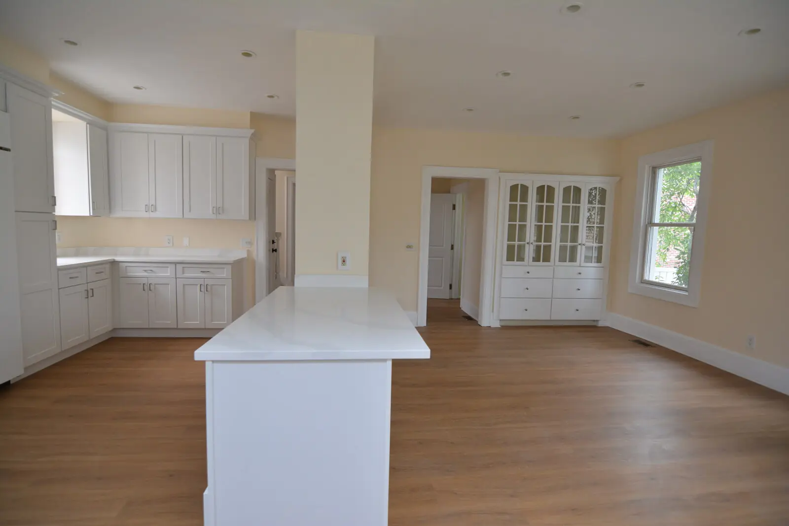 Wide view across the open kitchen and dining room