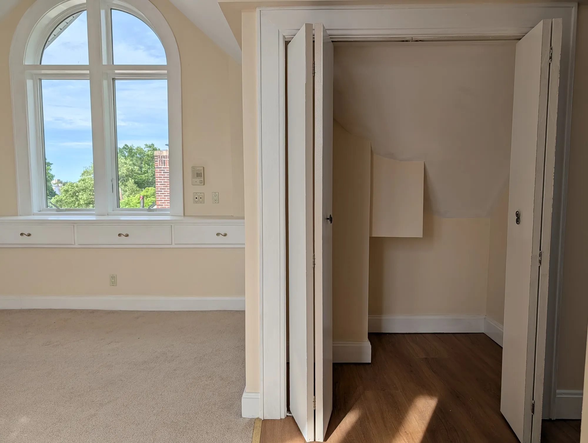 Built-in bank of drawers tucked into the suite eaves