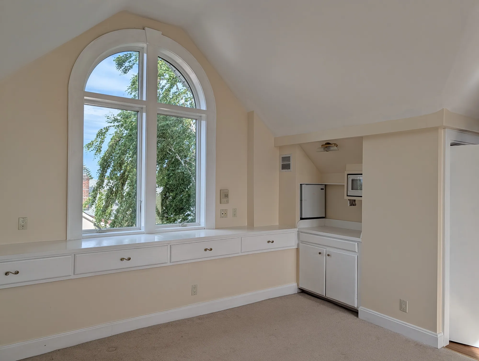 The southeast corner of the suite with the kitchenette built into the wall