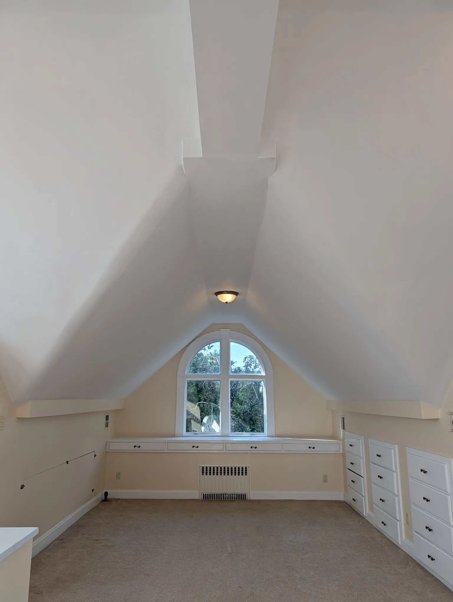 Looking north across the suite under the vaulted ceiling